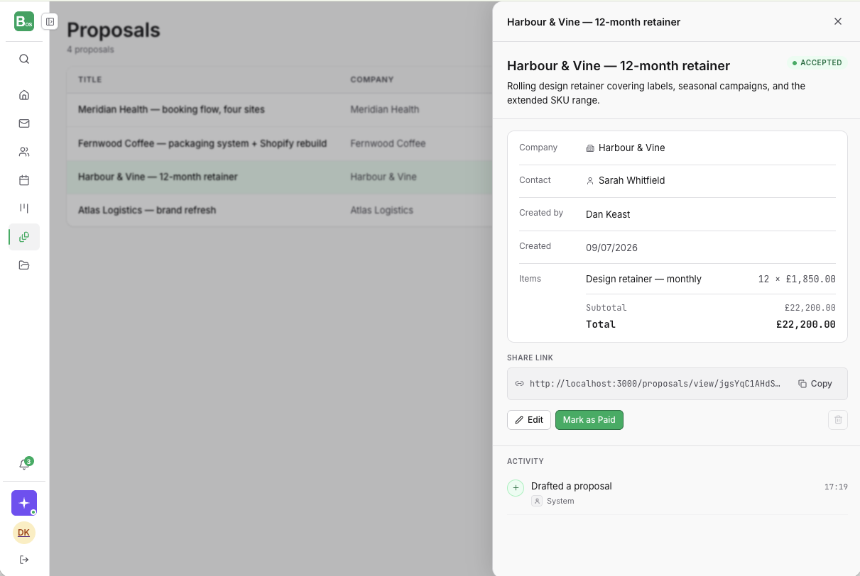 An accepted proposal in BusinessOS, showing a 12-month retainer itemised to £22,200, the linked company and contact, a shareable client link, and a one-click Mark as Paid action.